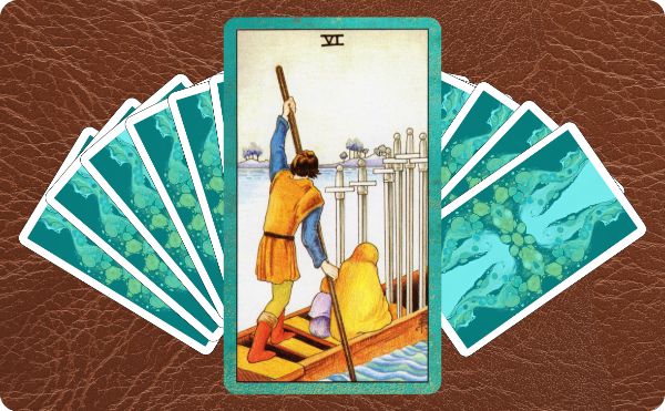 Rider Waite depiction of the Six of Swords tarot card on top of a spread of other cards.