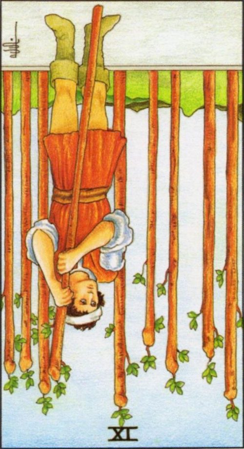 Rider Waite depiction of the Nine of Wands tarot card reversed.
